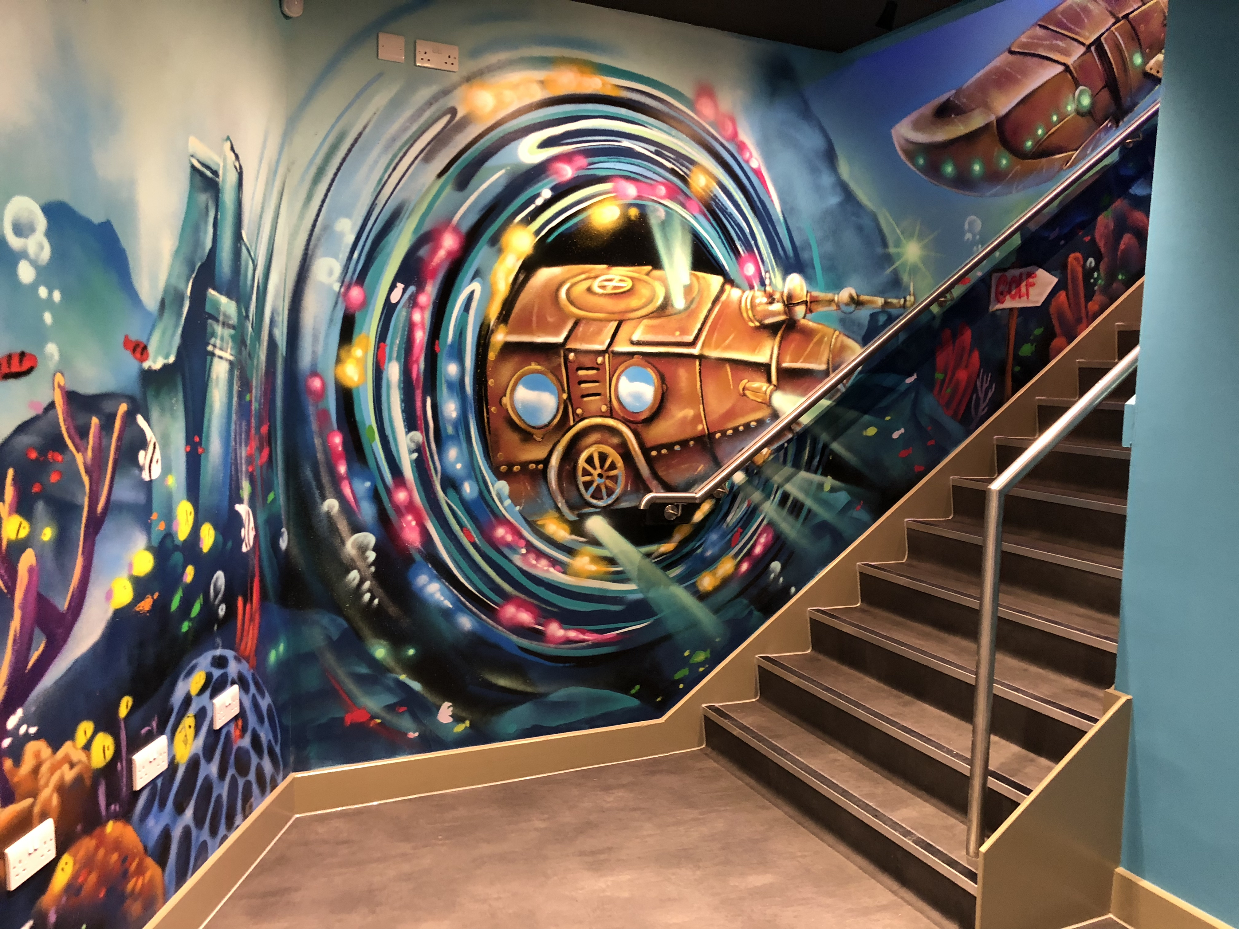 A view of the graffiti art on the stairs at lost world golf in Milton Keynes after the commercial fit out by RCEservices