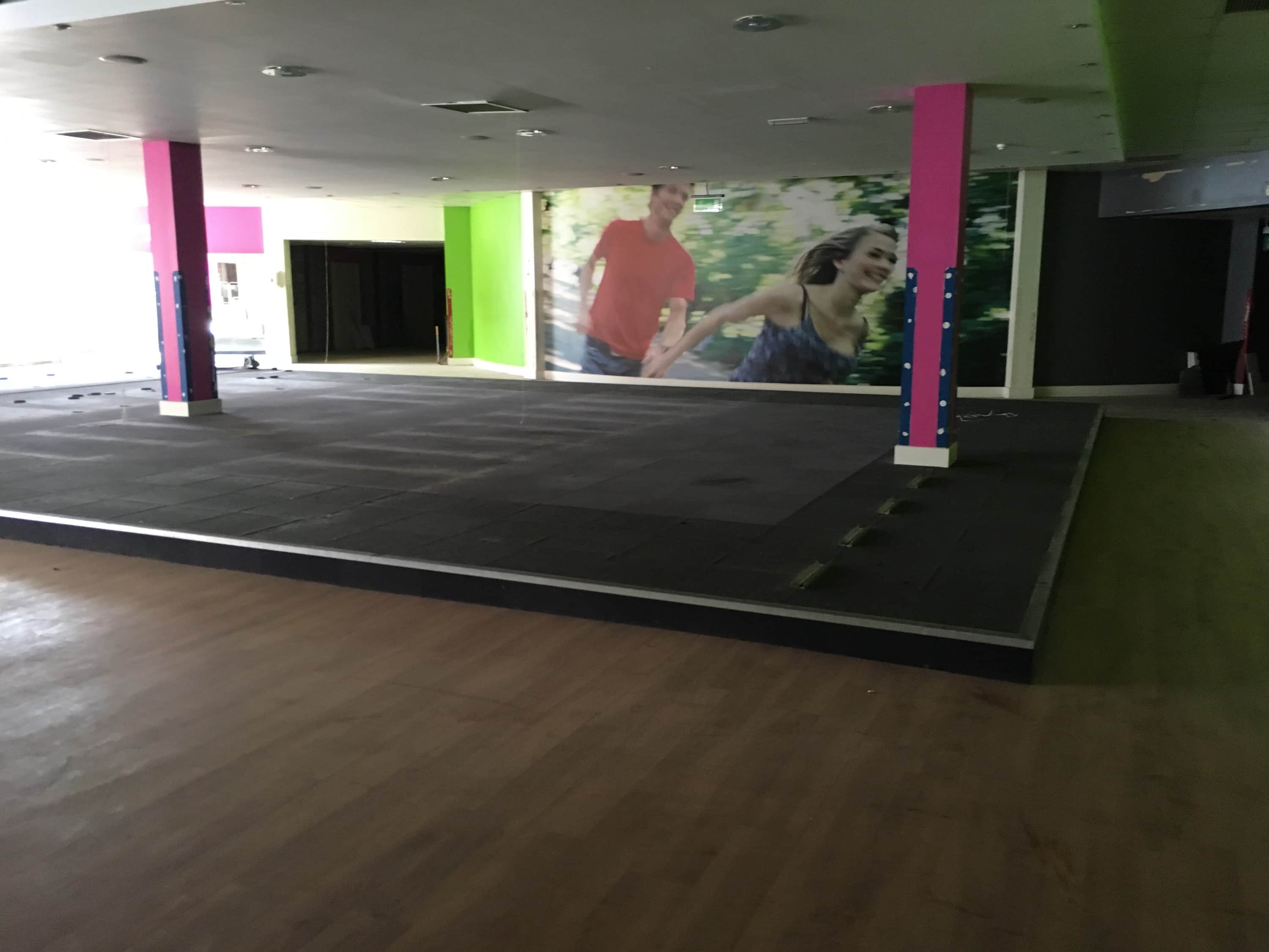 An image of the site before the fit out, depicting an empty former gym in a leisure complex in Milton Keynes