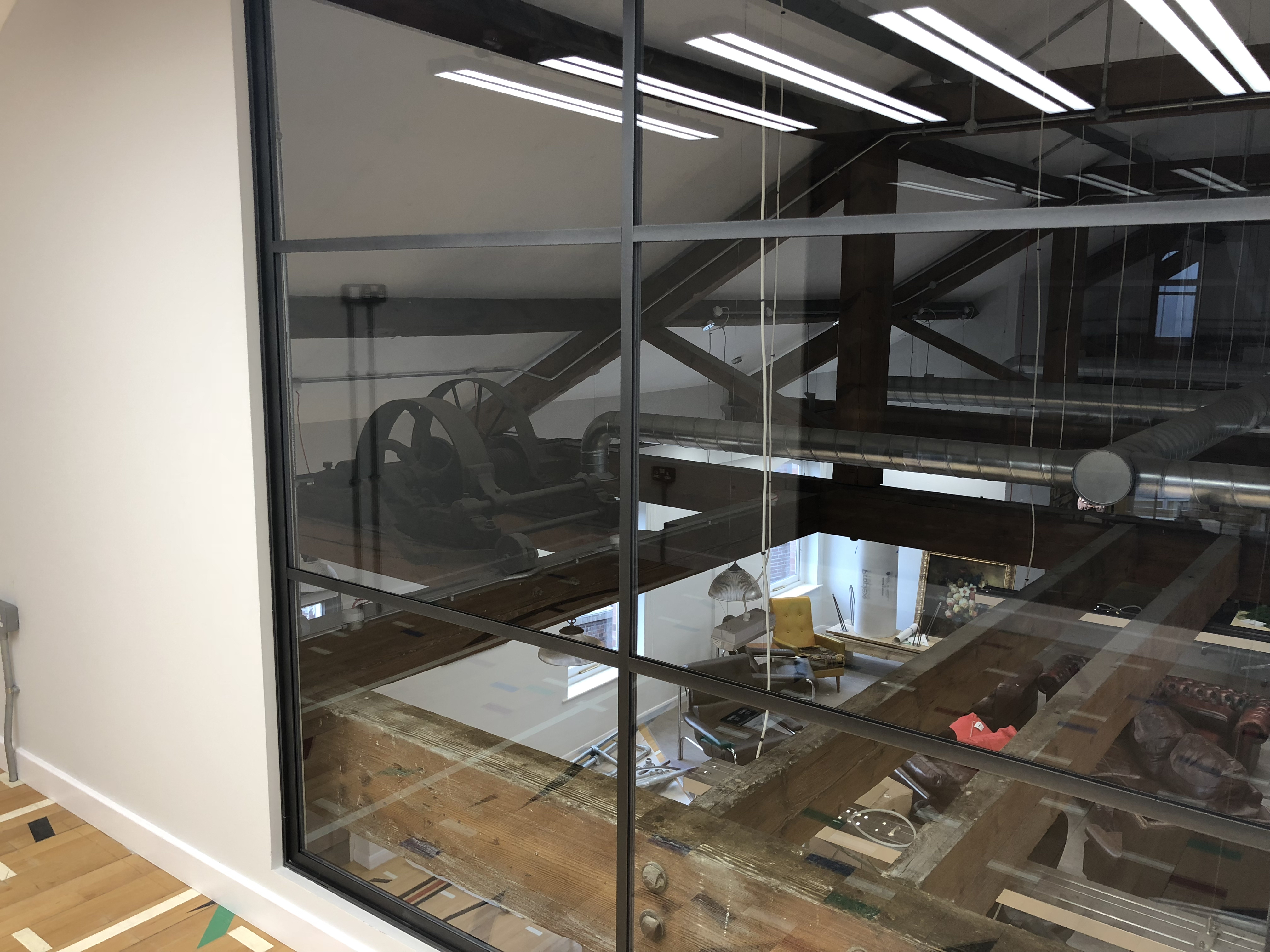 The view from floor to ceiling windows over the eaves in the private office on the mezzanine level of New York House in Leeds