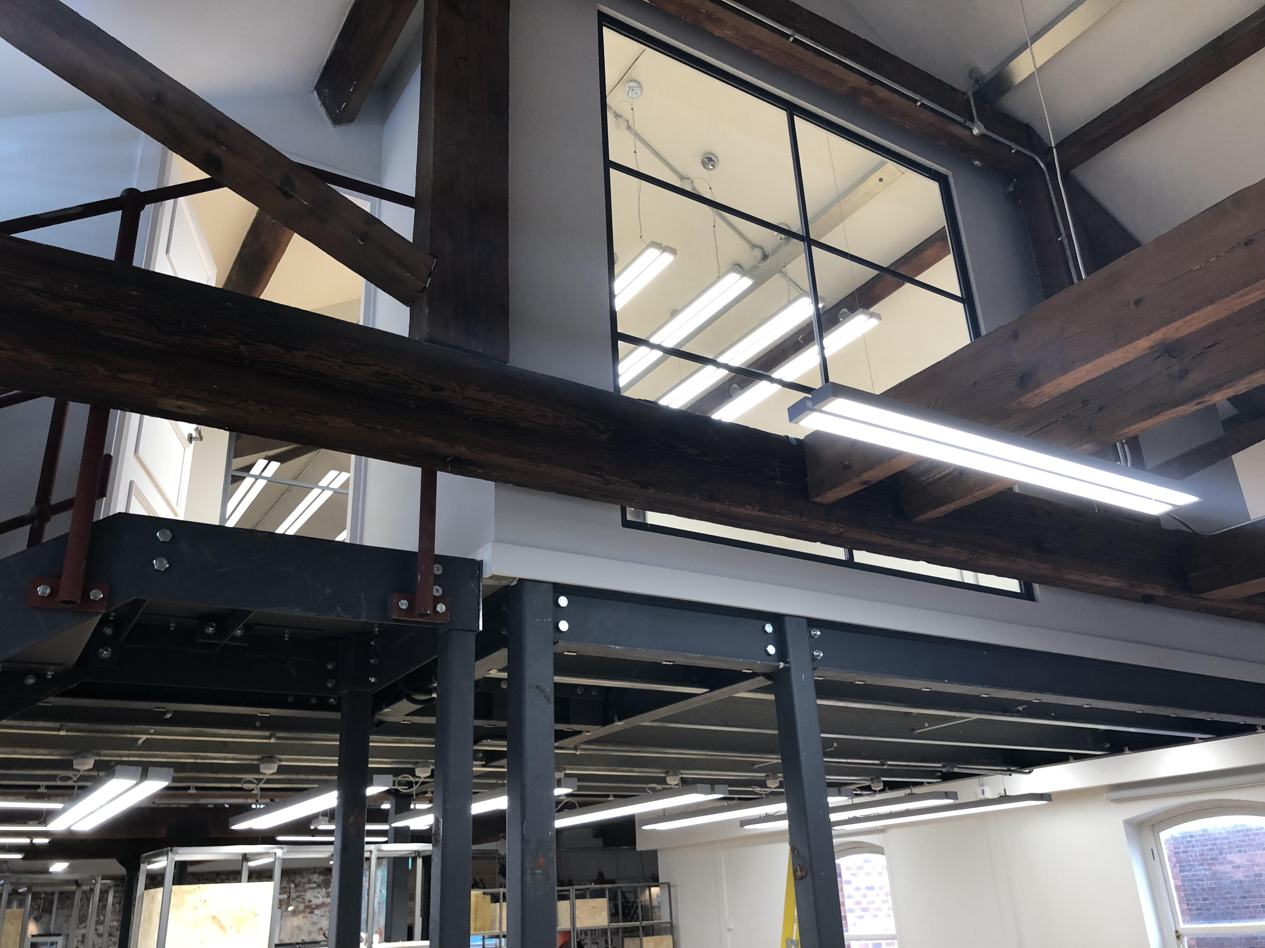 The view of the window on the mezzanine level private office in New York House in Leeds